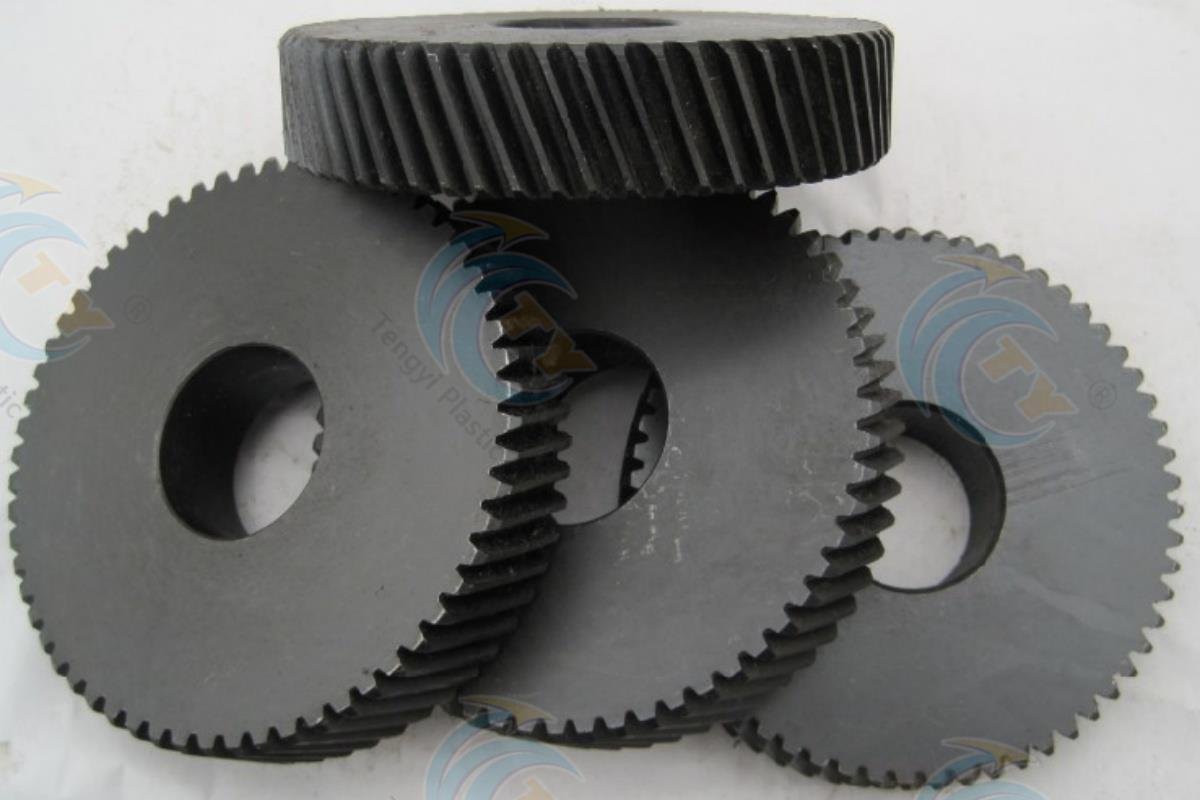 Black anti-static POM sheet formed into a circular gear component